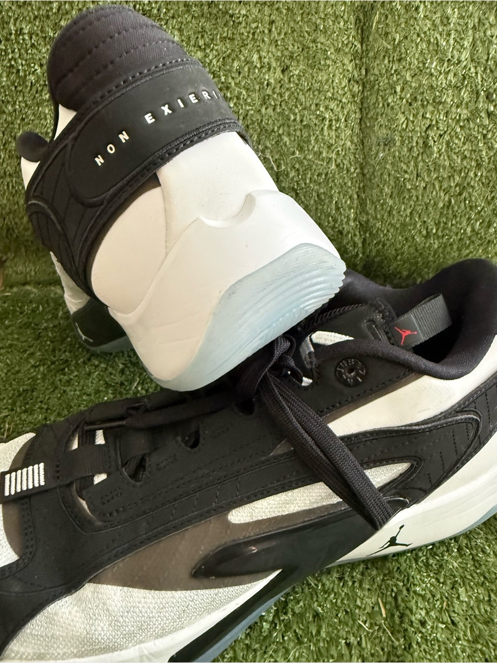Jordan Black and White Low-Top Sneakers with Subtle Red Jumpman